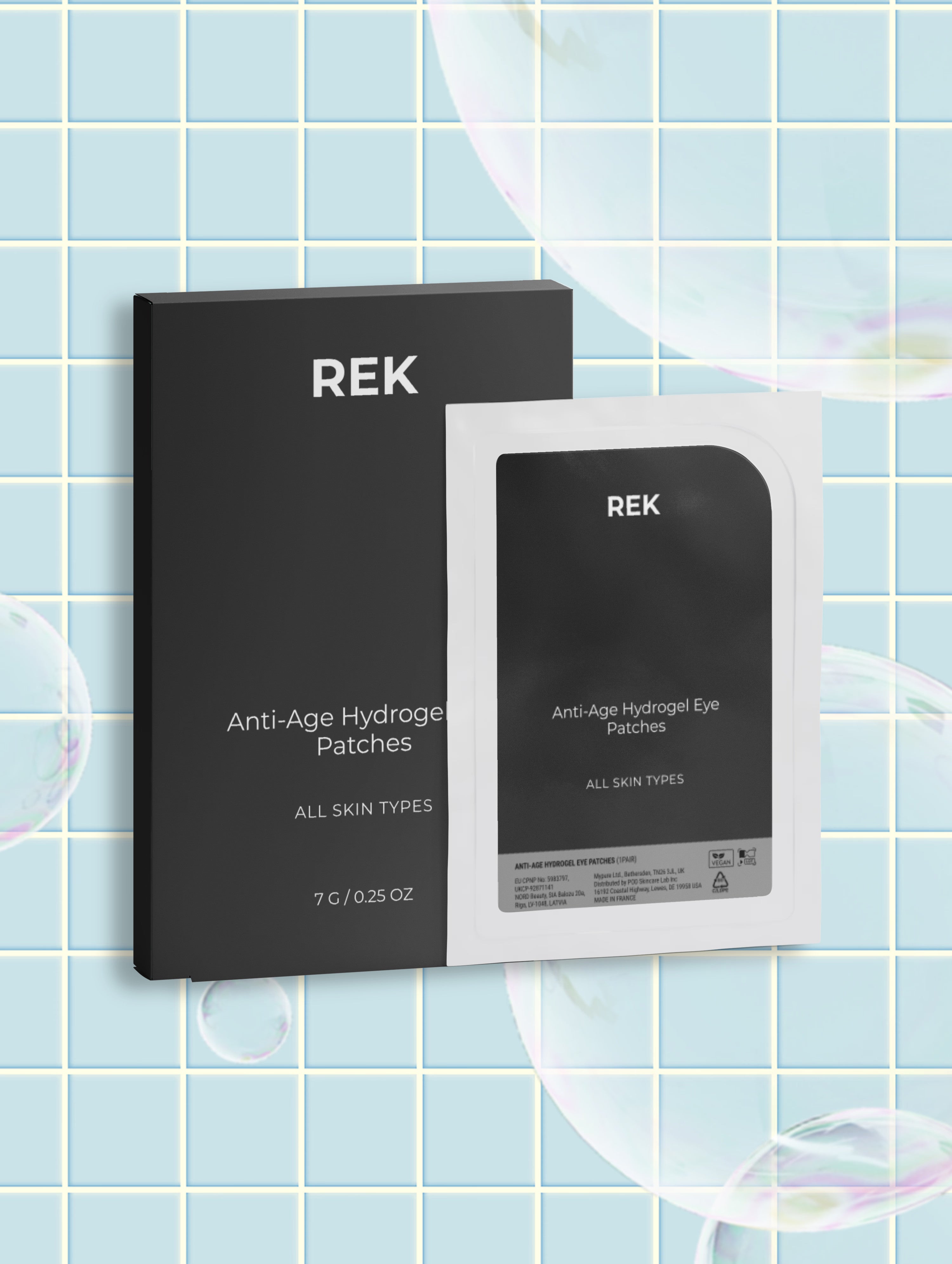 REK Anti-Age Hydrogel Eye Patches shown with a black outer box and a single white sachet package, set against a light blue tiled background with floating soap bubbles.