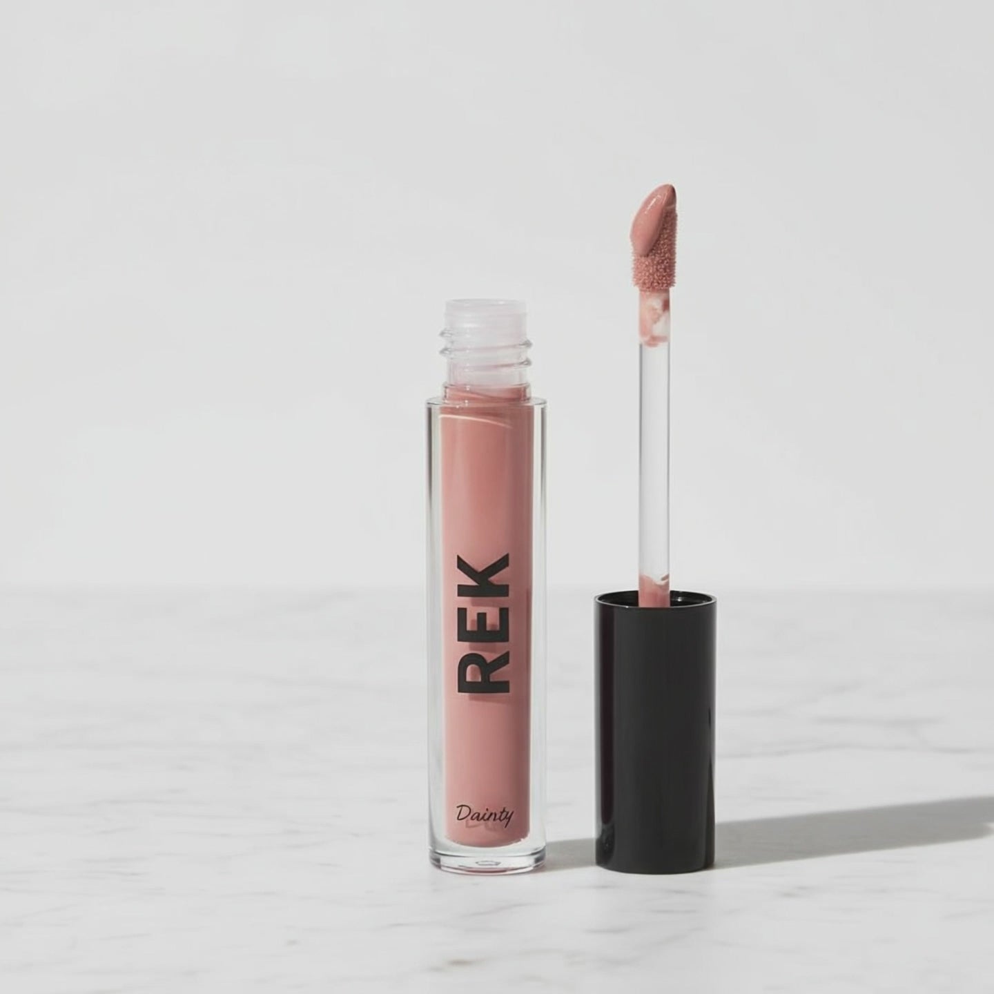 Dainty | Plumping Gloss | REK Cosmetics.